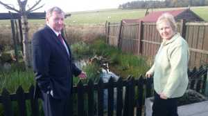 Alex views flooding with local resident Mrs Bennett