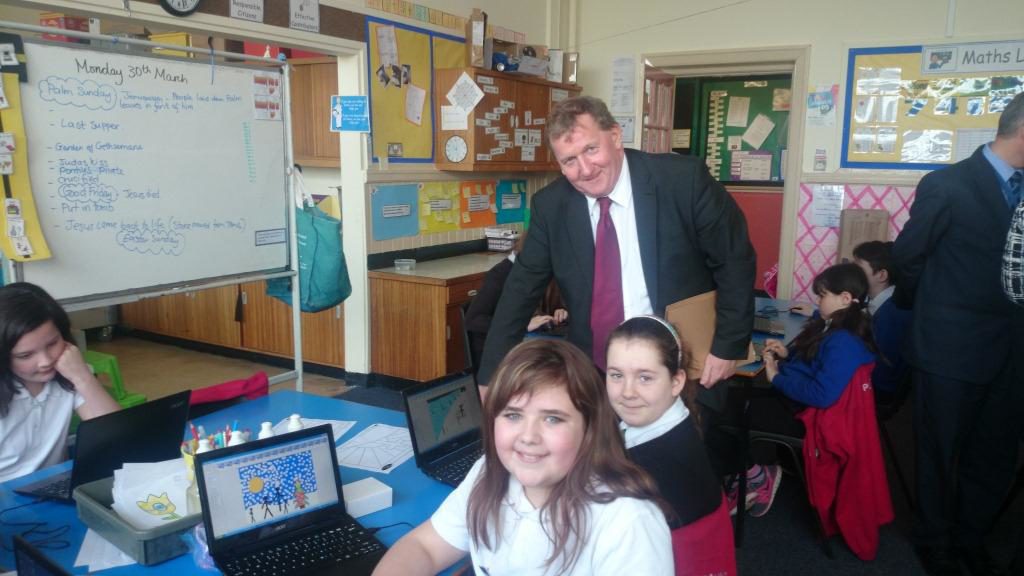 Kailya Reid and Jade Annal show Alex Rowley the programmes they are working on